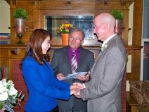 Karen Fishburn performing a wedding for a Spokane, Washington couple at a private home in Spokane.