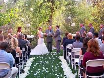 Ralph Fishburn, of Ralph's Regal Weddings, performing wedding at Chateau Rive, Spokane, Washington.