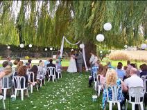 Ralph Fishburn, of Ralph's Regal Weddings, performing wedding ata private home, Spokane Valley, Washington.